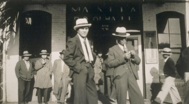 Filipinos in front of the Manila Pool Hall, Stockton, California (1929–1934).