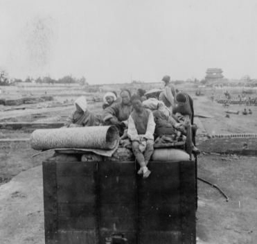 Chinese Christians leaving Peking (Beijing), China.
