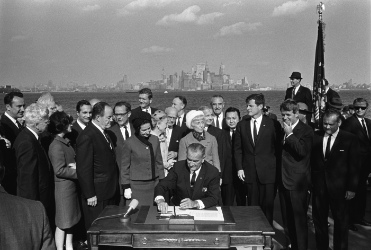 President Lyndon B. Johnson signs the Immigration Act on Liberty Island.